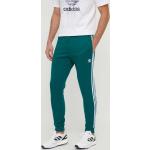 Férfi Poliészter Zöld adidas Adidas Originals Melegítő nadrágok Fenntartható forrásból akciósan L-es 